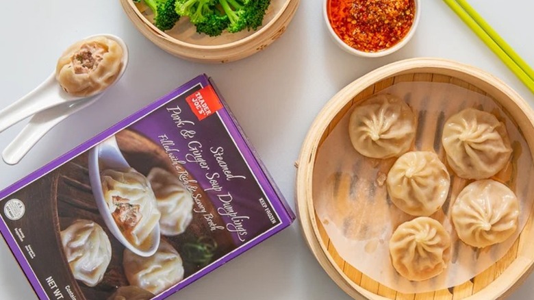 Box of Trader Joe's dumplings, dumplings in steamer basket, and spices
