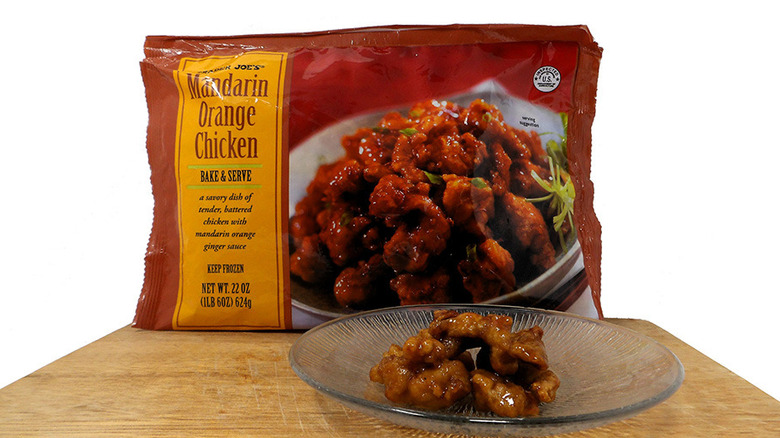 Plate with Trader Joe's Orange Chicken in front of package