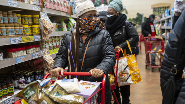 Masked woman in Trader Joe's