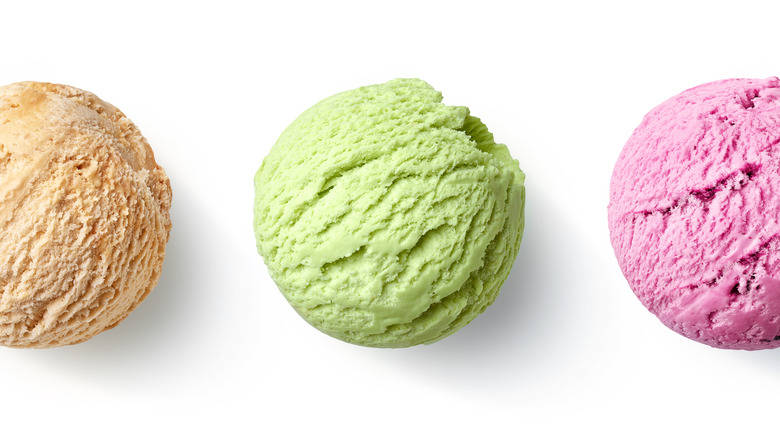 Three scoops of different ice cream flavors 