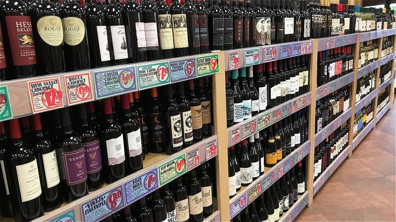shelves of red wine bottles
