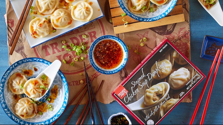 Trader Joe's steamed soup dumplings with chopsticks and sauce