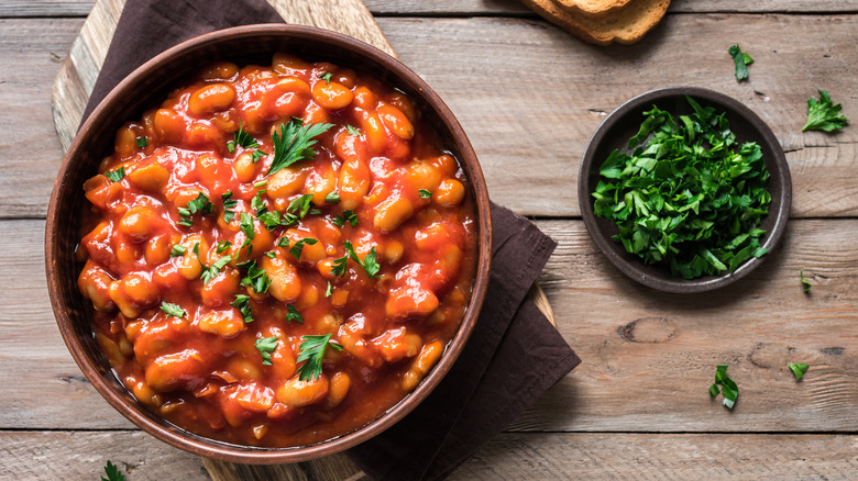 Bowl of chili, blue bowl, Scallions