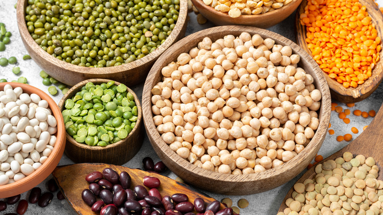 Bowls of dried chickpeas and lentils