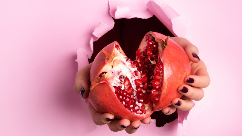 pomegranate sliced in half, seeds