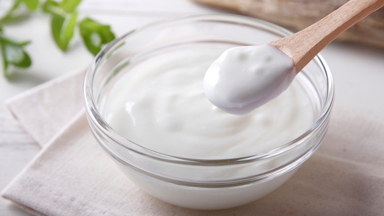 White yogurt in a clear bowl