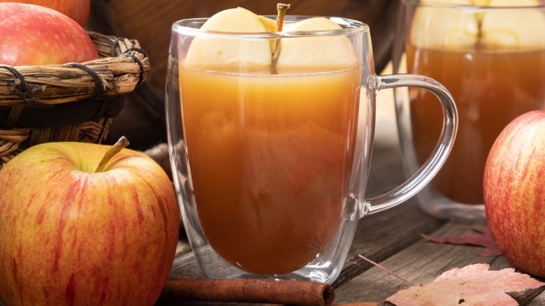 Apple inside a cup of apple juice