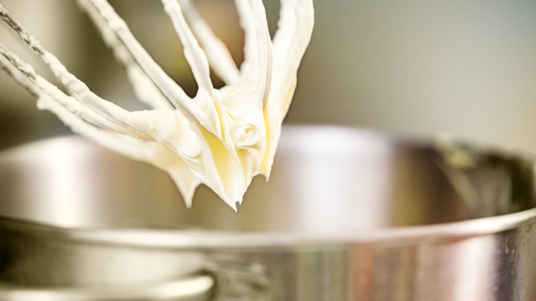 Cream cheese frosting on a whisk