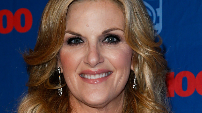 Trisha Yearwood against blue wall