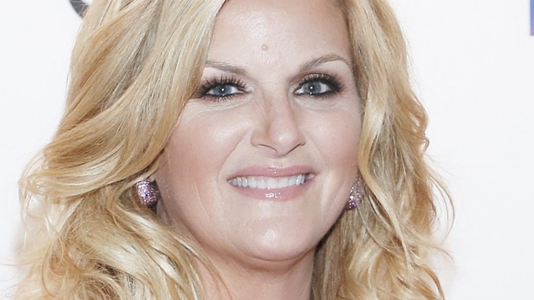 Trisha Yearwood smiles with sparkling earrings