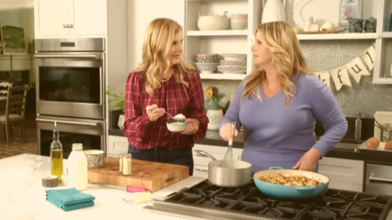Trisha Yearwood and sister Beth in the kitchen cooking
