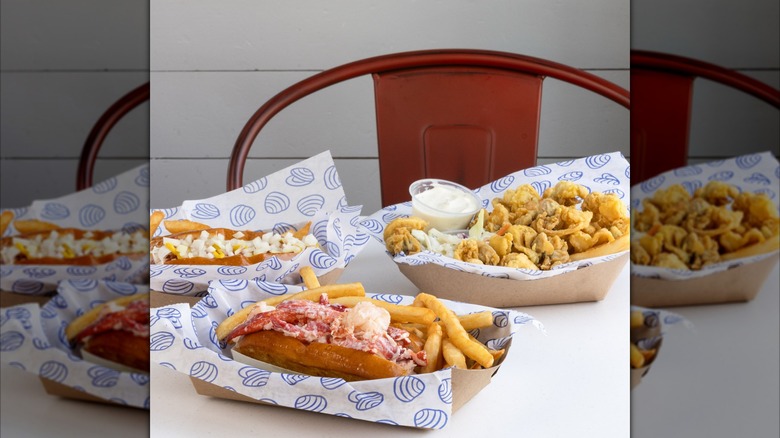 Hot dog, lobster roll, and fried clam basket