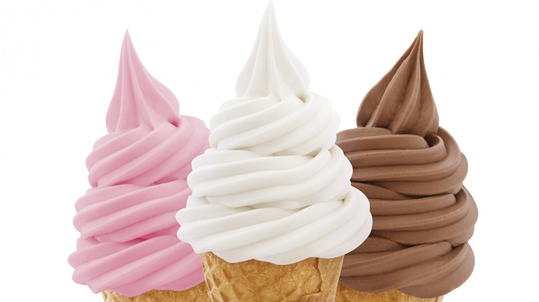 Three soft-serve ice cream cones