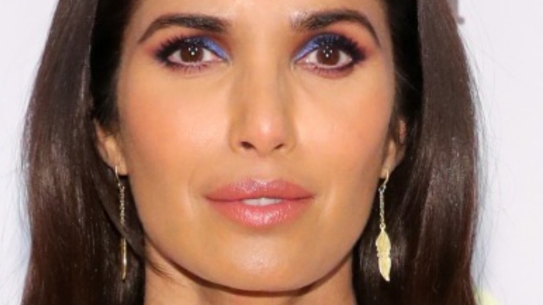 Padma Lakshmi with colorful eye makeup and slight smile