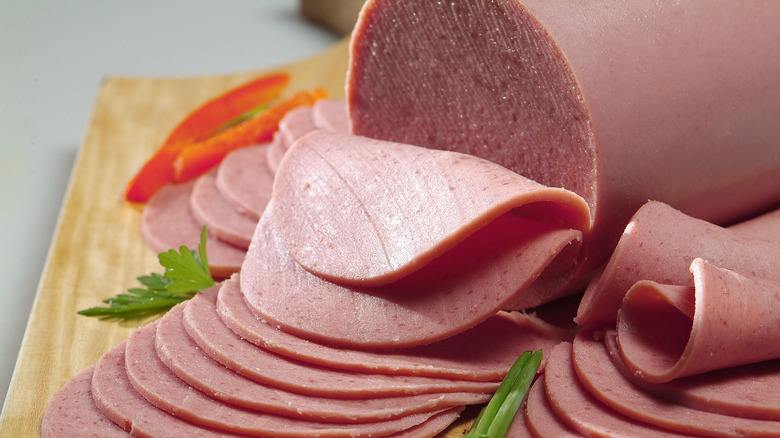 slices of bologna on a cutting board
