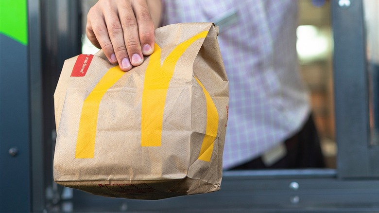 McDonald's bag being handed over in the drive through 