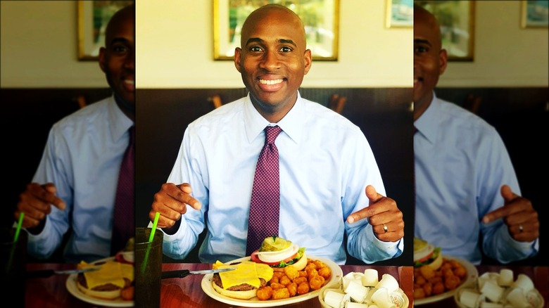 Omari Hardy sitting in restaurant