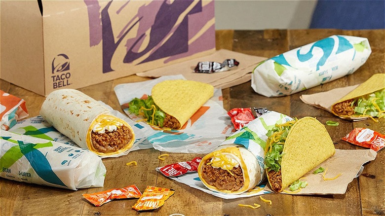 Assortment of Taco Bell menu items on wooden table