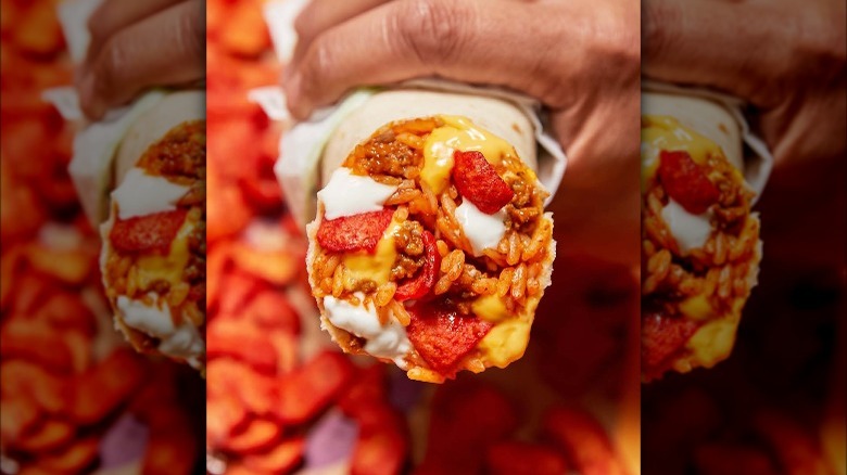 Person holding Beefy Crunch Burrito 