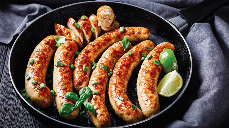 Sausage in pan with herbs