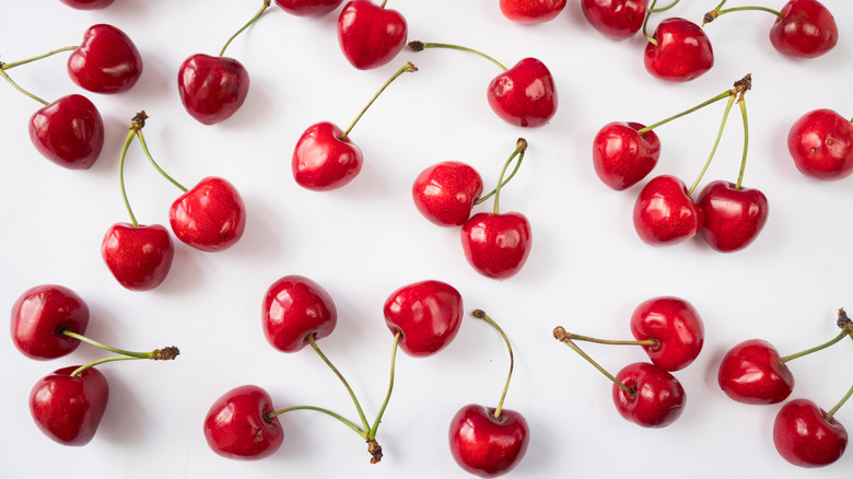 Different cherries against a white background