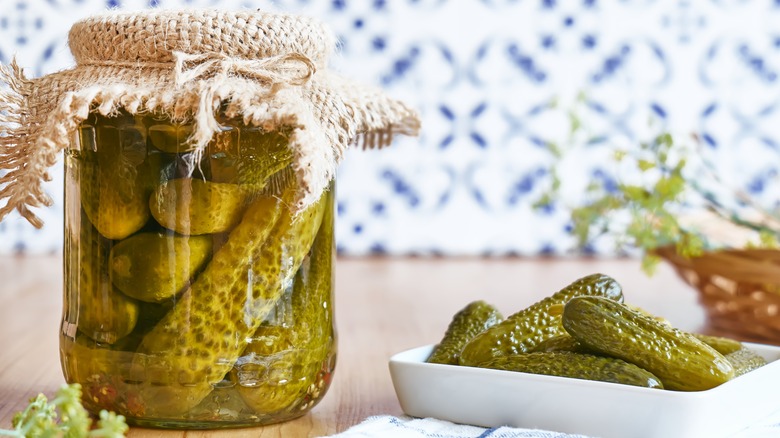 Jar and bowl of pickles