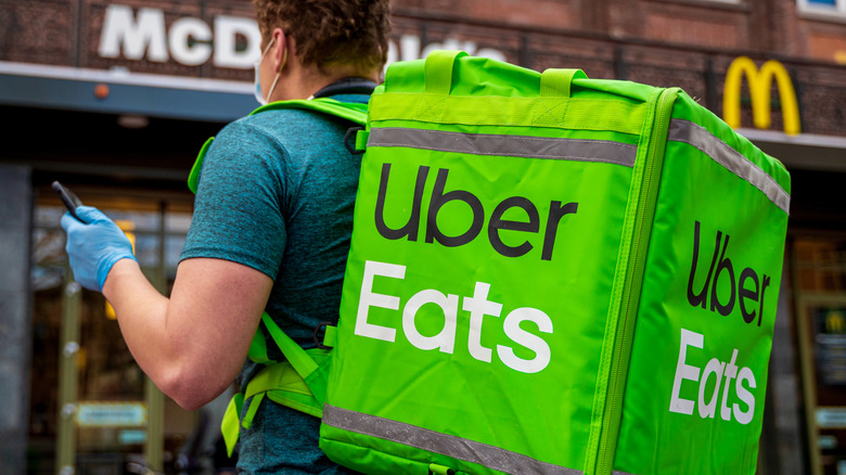 Uber Eats delivery driver outside McDonald's