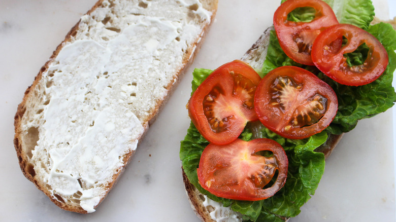 BLT sandwich being assembled