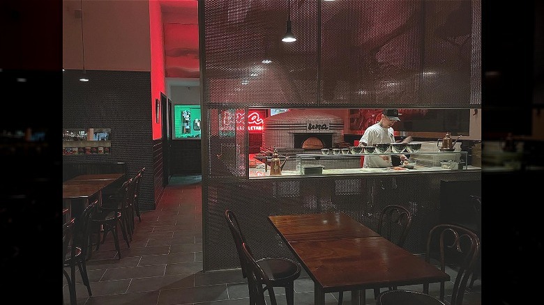 Cook in kitchen empty restaurant