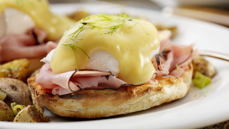 eggs benedict on a white plate