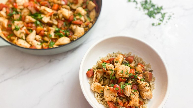 bowl and serving dish of chicken cacciatore