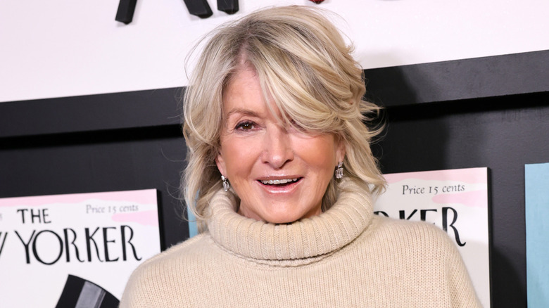 Martha Stewart wearing a beige turtleneck sweater at an event.