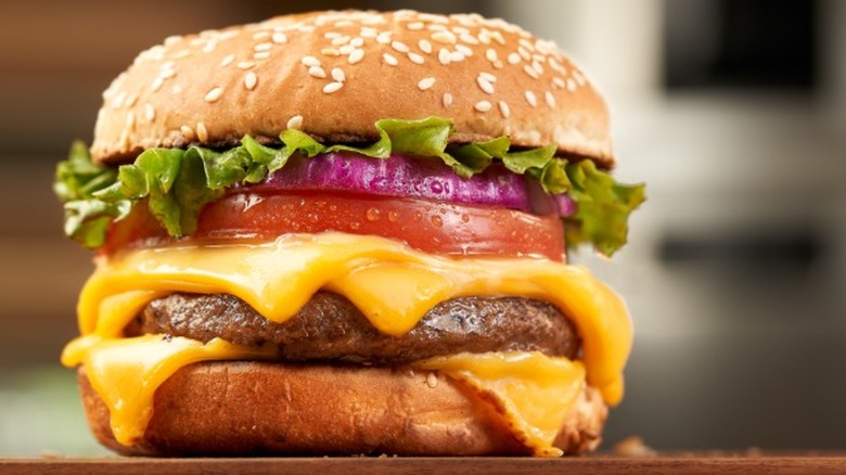 Cheeseburger on wooden surface