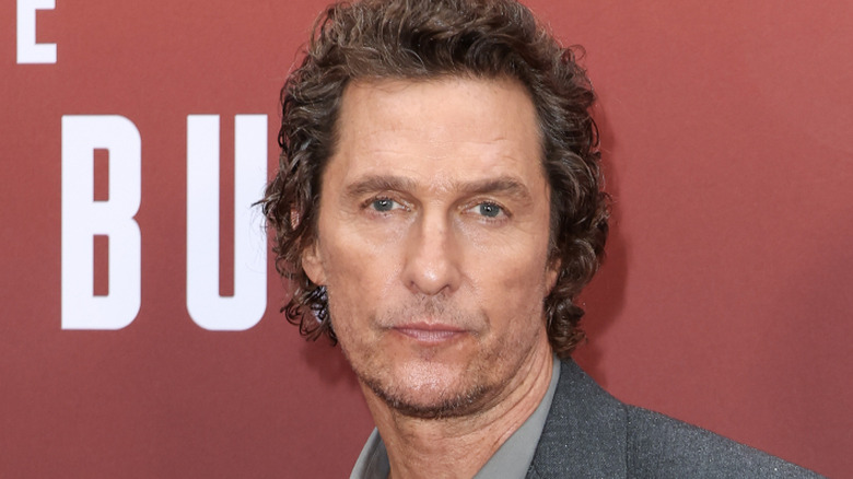 Matthew McConaughey posing for cameras at publicity event