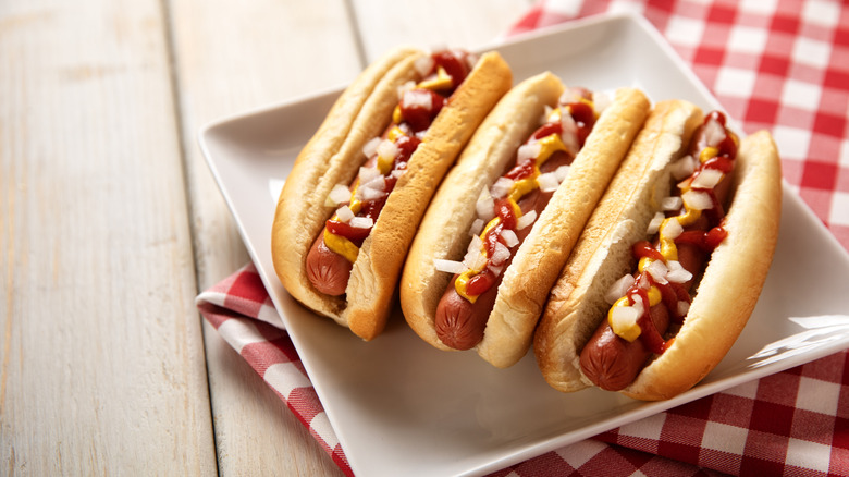 three hot dogs on a plate