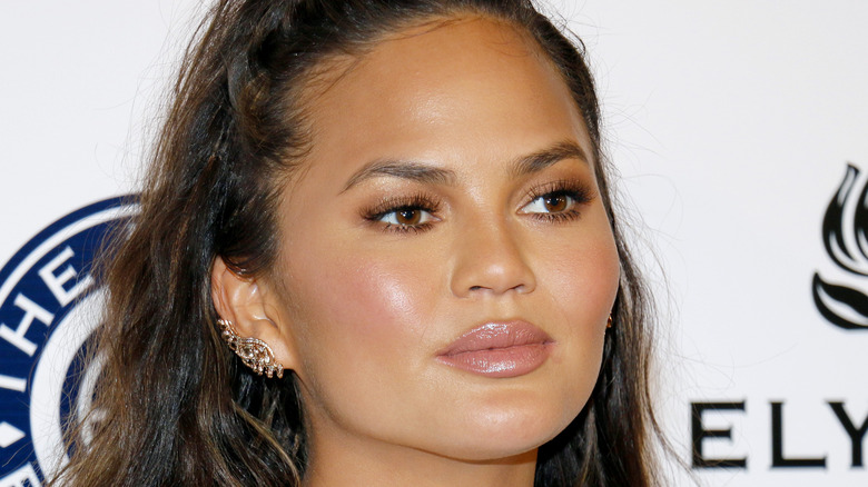 Chrissy Teigen with neutral expression