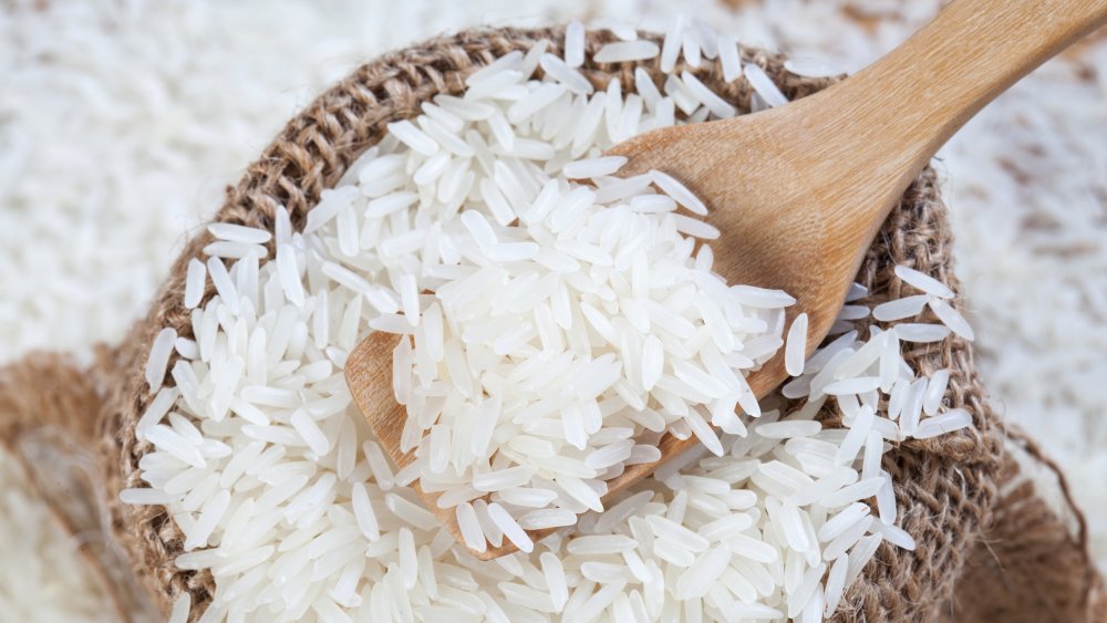 bag of rice with wooden spoon