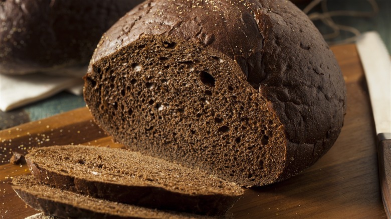 loaf of pumpernickel bread, sliced