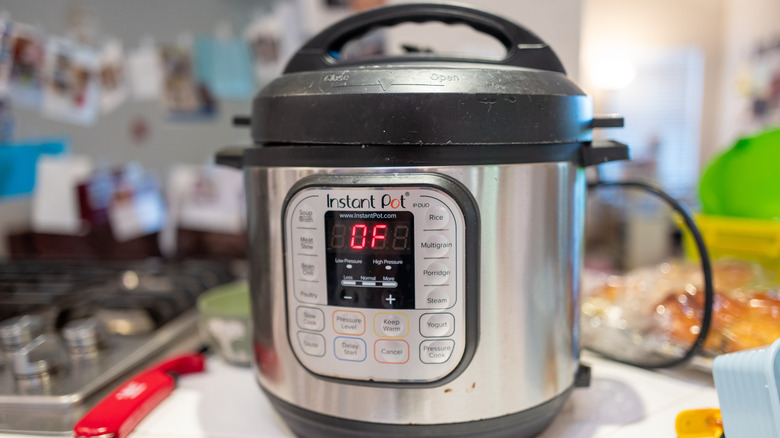 An Instant Pot pressure cooker and multi-use cooker on a countertop