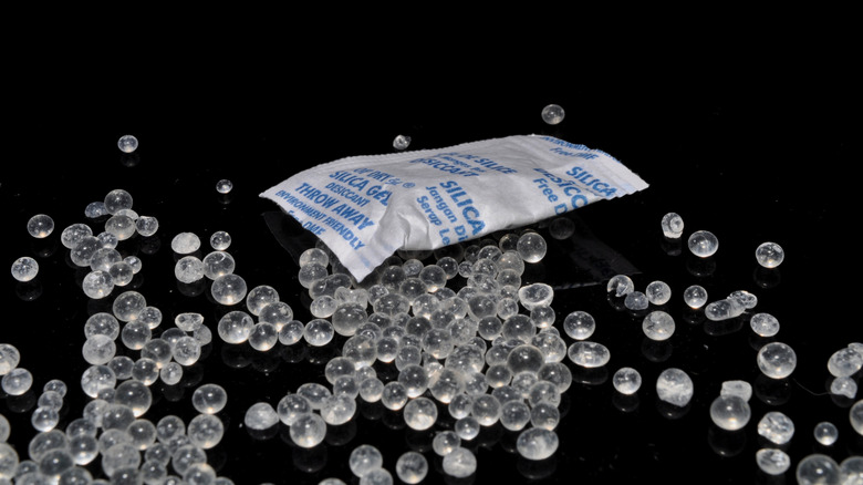 Sillica gel packet surrounded by sillica balls