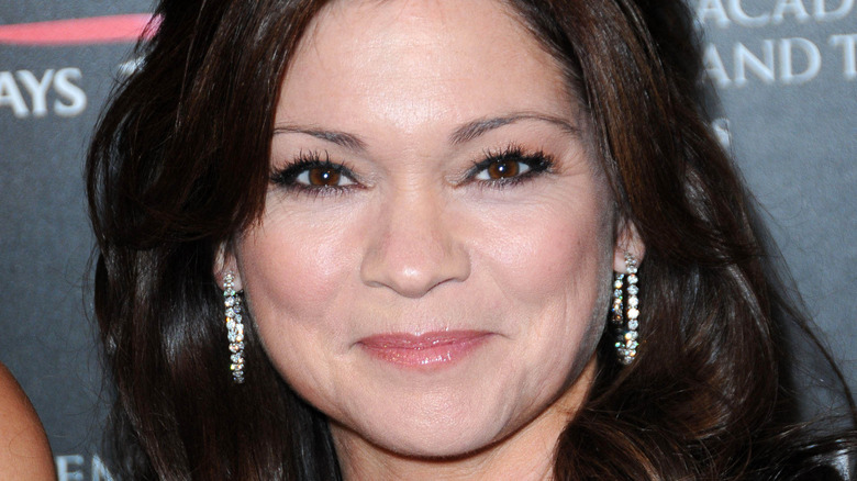 Closeup of Valerie Bertinelli with silver earrings