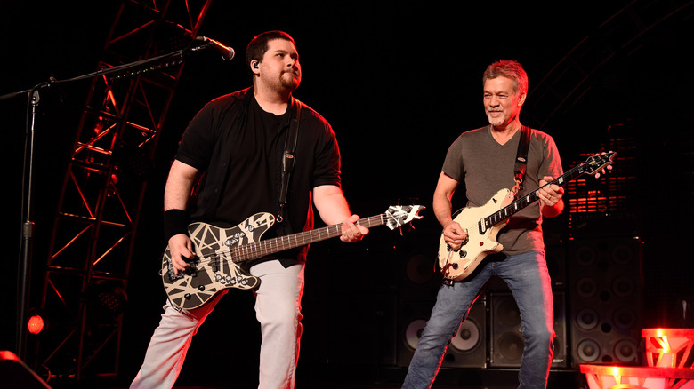 wolfgang and eddie van halen playing guitar on stage
