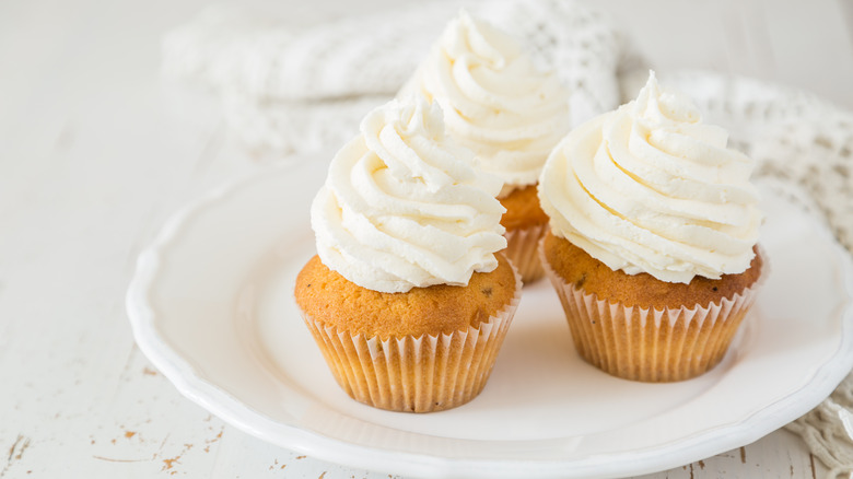 Vanilla cupcakes on white plate