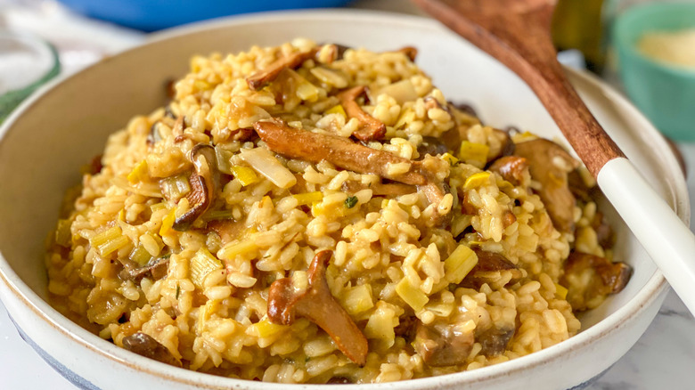 mushroom risotto in white bowl