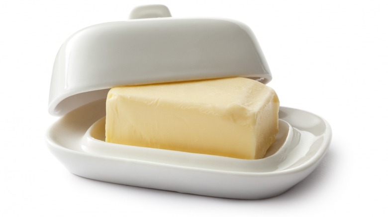 Stick of butter in butter dish