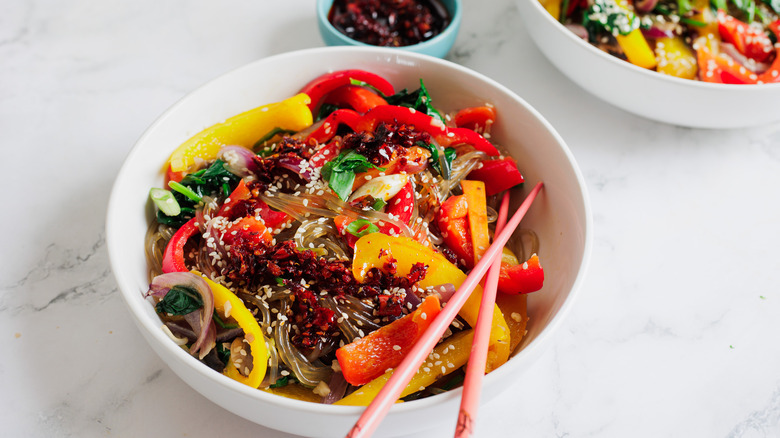 bowls of noodles and vegetables 