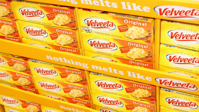 Stacks of Velveeta cheese on grocery shelves