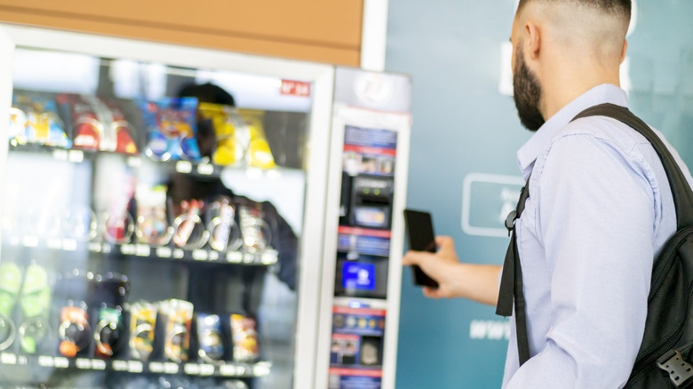 Man using vending machine