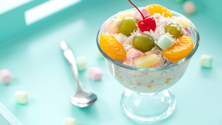 fruit on top of ambrosia salad with cherry