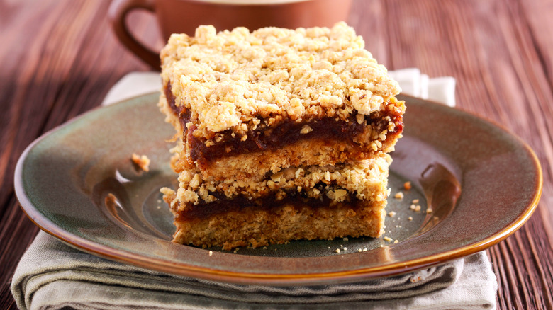 date bars on plate with coffee cup